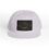White cap with a black rectangular patch featuring a gold design.