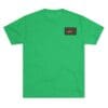 Green t-shirt with a small black and red patch on the chest.