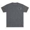 Gray t-shirt with a small green graphic design on the chest pocket area.