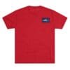Red T-shirt with a small blue and white patch on the chest.