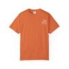 Orange T-shirt with small white text on chest.