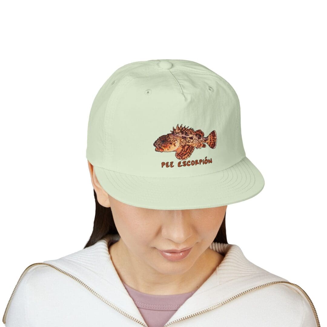 Light green cap with a hedgehog and text design.