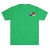 Green T-shirt with a small colorful graphic on the upper left chest.