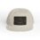 Beige baseball cap with a black patch featuring a fish design.