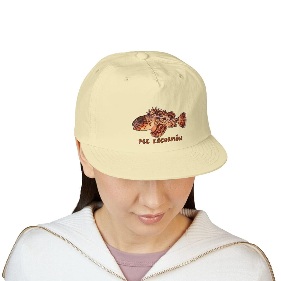 Beige cap with a brown embroidered hedgehog and text on front.