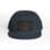 A navy blue baseball cap with a rectangular patch on the front.