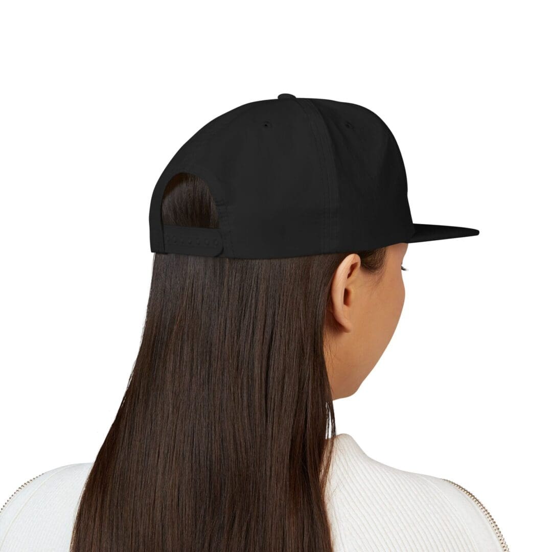 Person wearing a black baseball cap, viewed from behind.