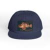 A navy blue cap with a colorful embroidered patch on the front.